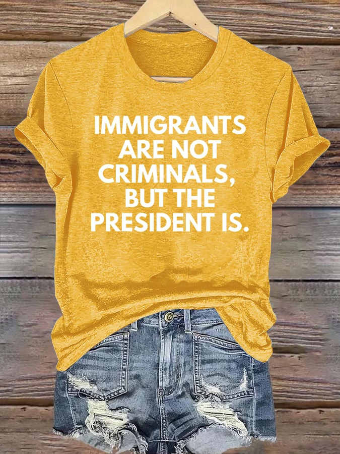Women's IMMIGRANTS ARE NOT CRIMINALS, BUT THE PRESIDENT IS. T-Shirt