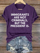 Women's  IMMIGRANTS ARE NOT CRIMINALS, BUT THE PRESIDENT IS. T-Shirt