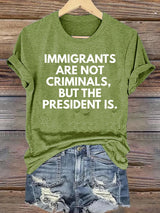 Women's  IMMIGRANTS ARE NOT CRIMINALS, BUT THE PRESIDENT IS. T-Shirt