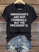 Women's  IMMIGRANTS ARE NOT CRIMINALS, BUT THE PRESIDENT IS. T-Shirt